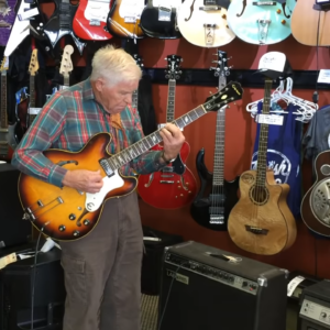 An 81-year-old grandpa walks into a guitar store, picks up one of the guitars, and starts playing to everyone’s amazement.