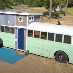 Family of 7 lives in converted bus with added loft and Dad gives a tour of their amazing home