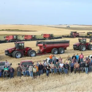 Dozens of farmers finish harvest for neighbor who had heart attack after trying to extinguish farm fire