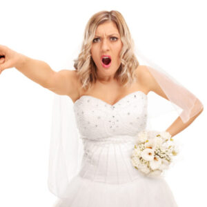 Woman blasted by bride for wearing old wedding dress on her big day