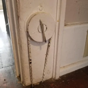 What’s this dial in an old house that has a chain embedded in it? What’s this dial in an old house that has a chain embedded in it?