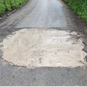 Motorist Fills Pothole Without Consent- Private Company Gets Enraged