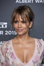 Undressed Halle Berry rolls in bed wearing Catwoman mask for film’s anniversary