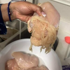 A woman posts a picture of a chicken breast that looked stretched out like spaghetti.