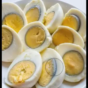 Why does a green ring appear around hard-boiled eggs?
