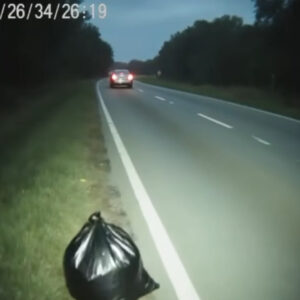 Without a word, the driver steered near the middle of the lane. On the… Without a word, the driver steered near the middle of the lane. On the…