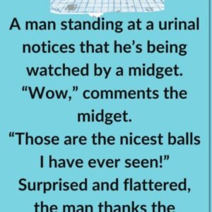 A man standing at a urinal