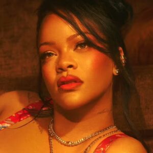 Rihanna oiled up on her knees in lingerie with giant hole on booty exposing all